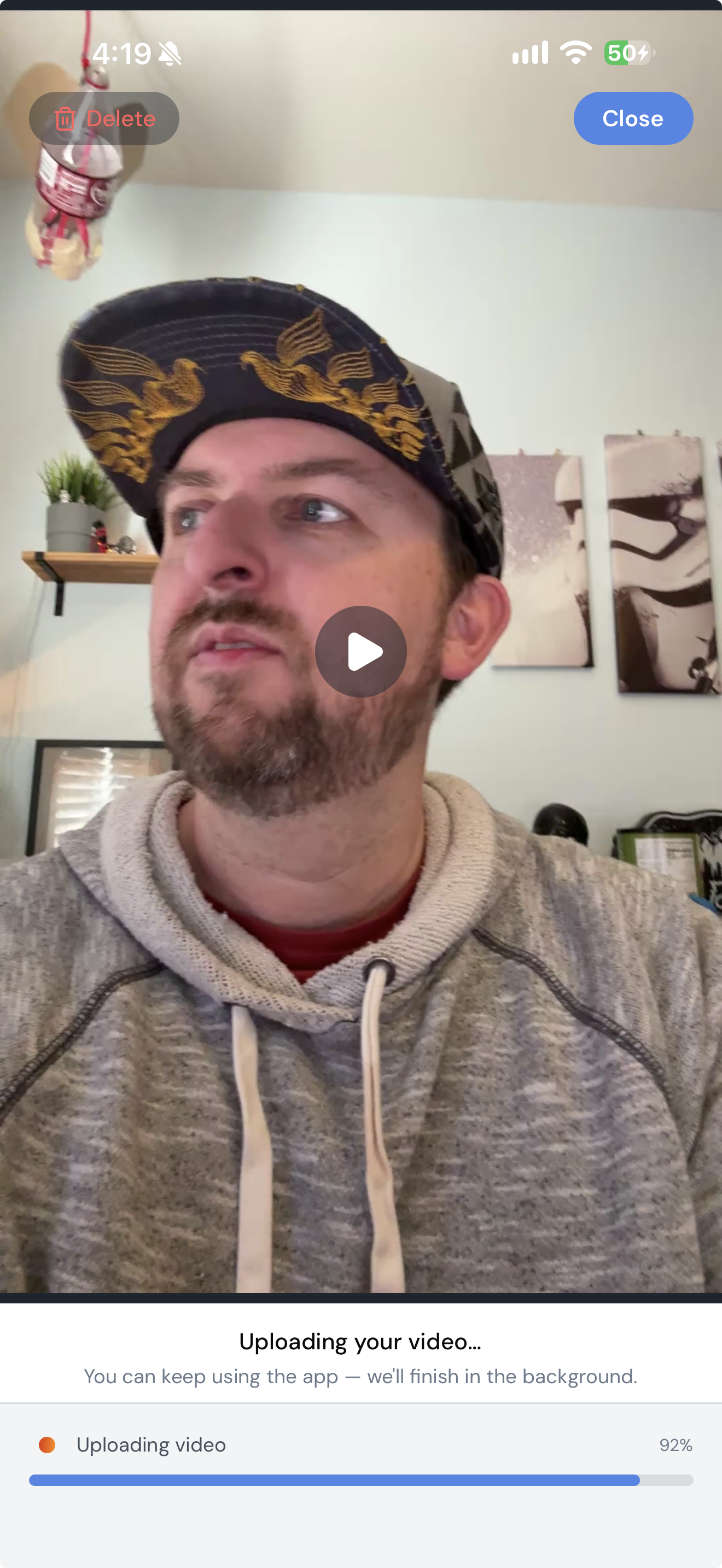 A video uploading, with the progress bar and the Done and Delete buttons